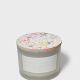 Scented jar candle, gray glass with Sand + Fog label and floral lid