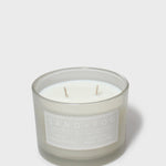 Scented jar candle with white wax and two wicks, gray glass, Sand + Fog label