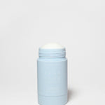 Pale blue deodorant container with white screw-on cap