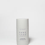 SAND + FOG deodorant stick, white tube with violet sandalwood label