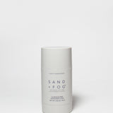 SAND + FOG deodorant stick, white tube with violet sandalwood label