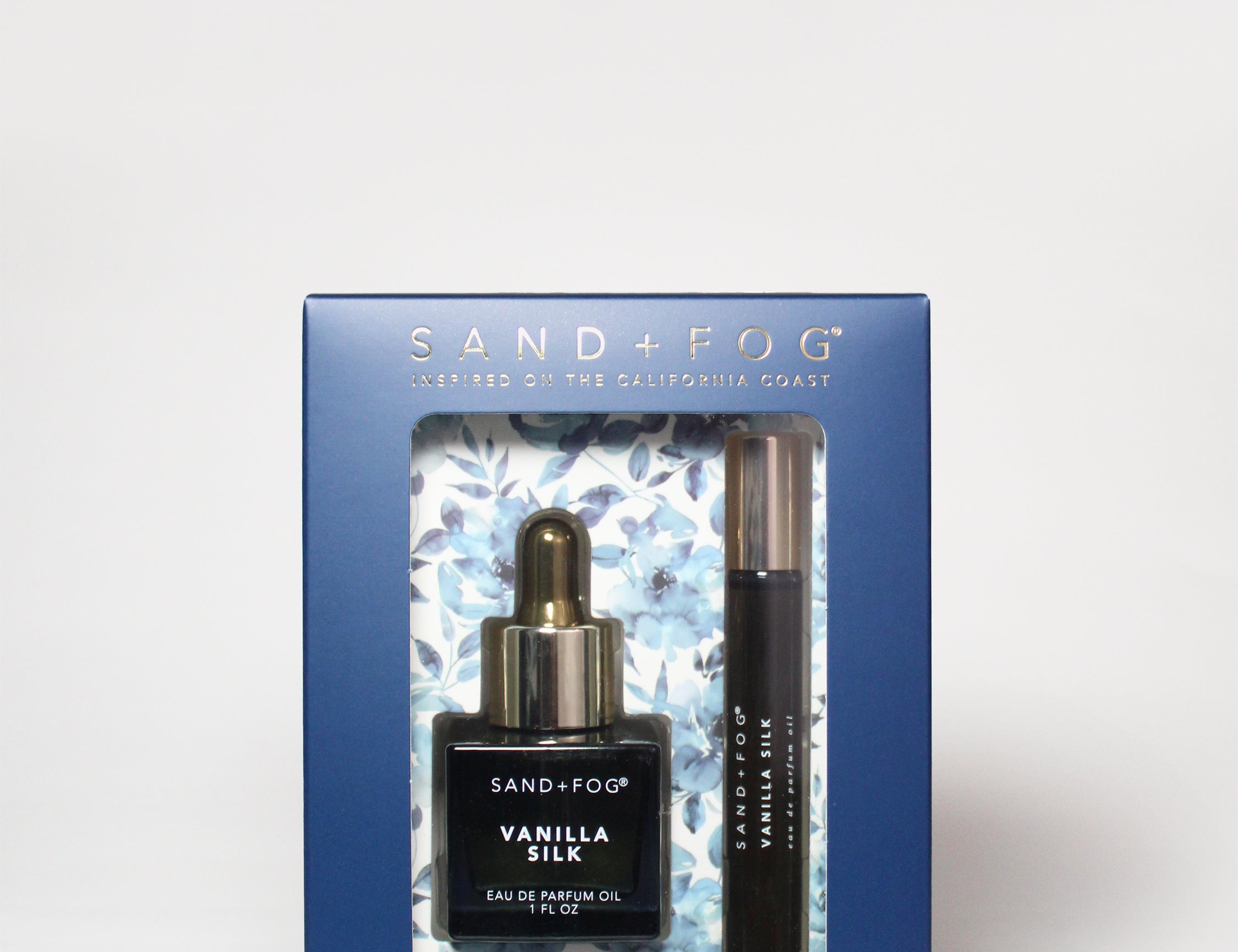 Perfume oil rollerball and dropper set in blue gift box with two bottles