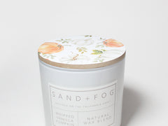 SAND + FOG scented candle with floral lid, white glass jar and printed label