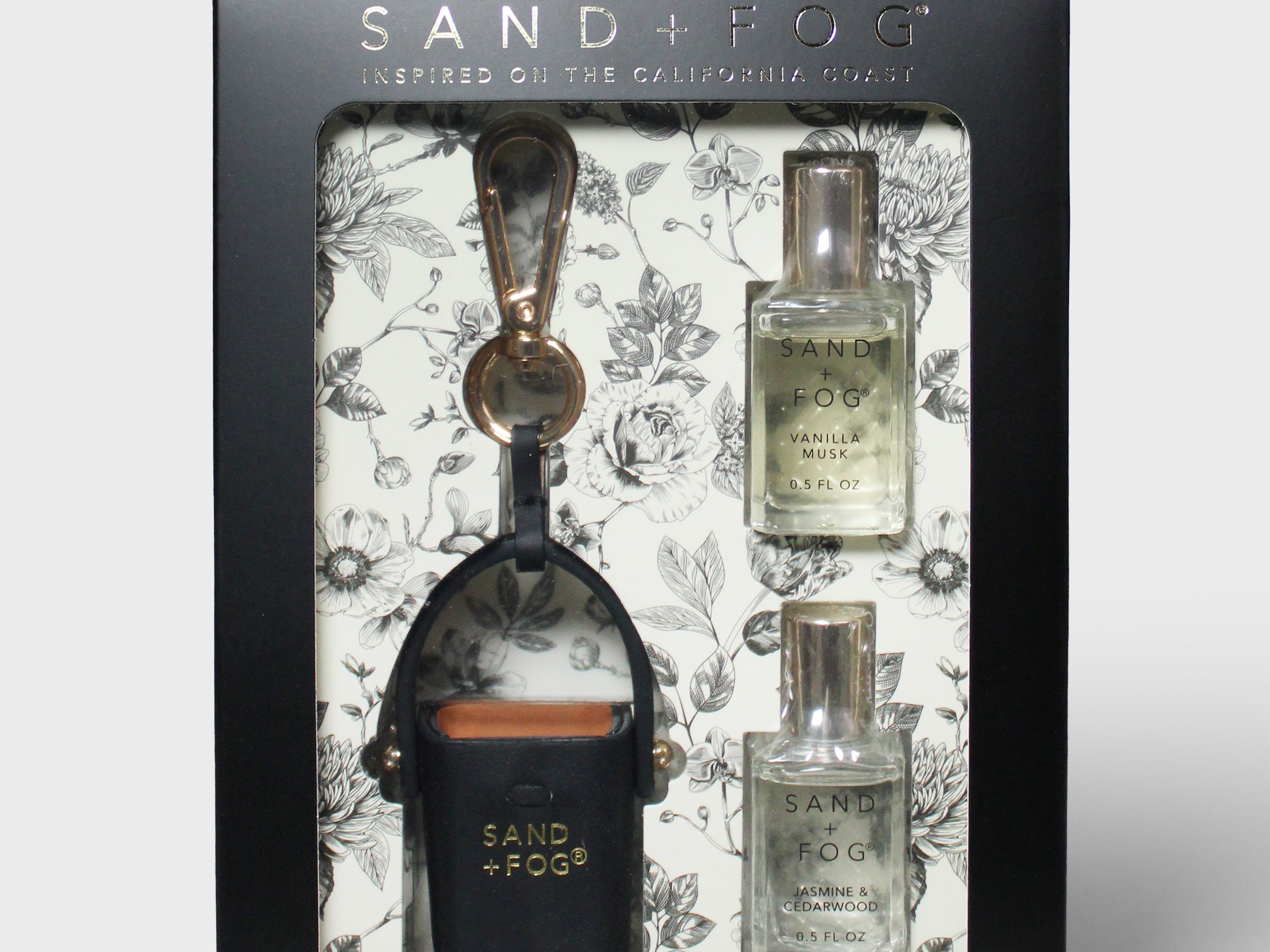 Perfume oil rollerball set in black floral gift box with two refills and bag charm