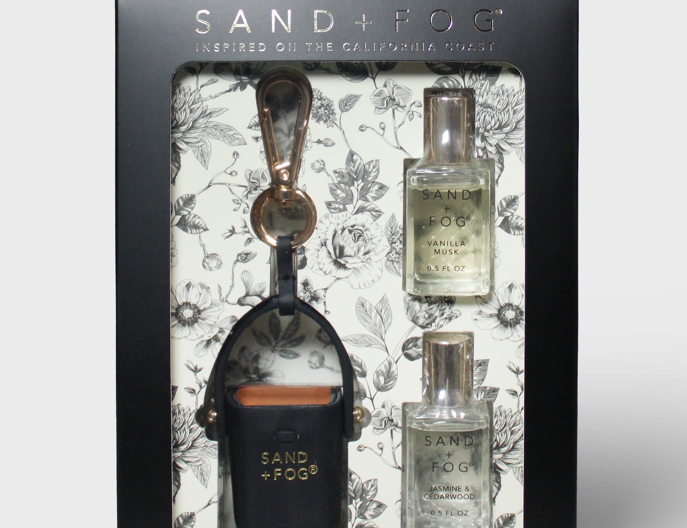 Perfume oil rollerball set in black floral gift box with two refills and bag charm