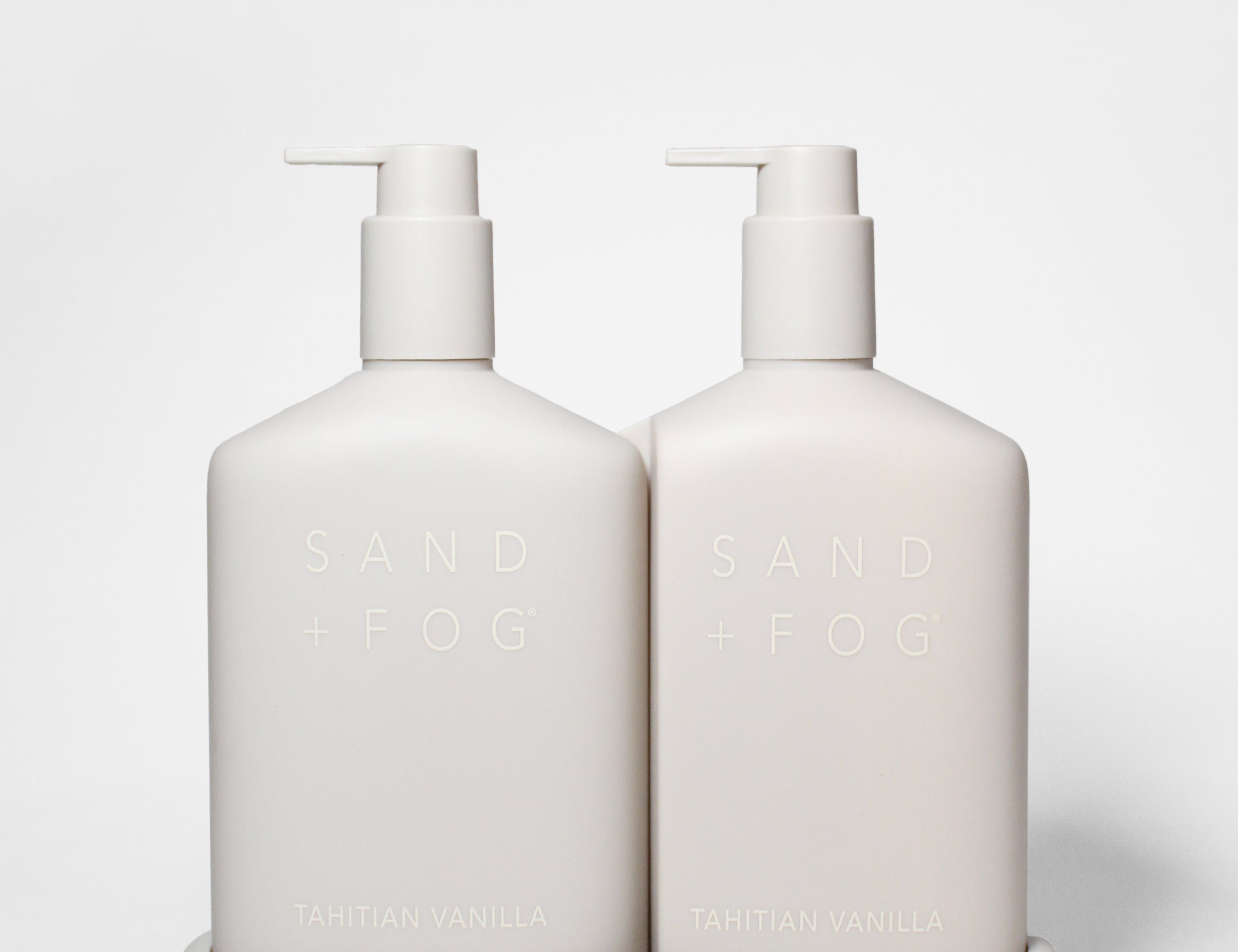 Tahitian Vanilla hand soap and lotion set in two white pump bottles with a matching tray