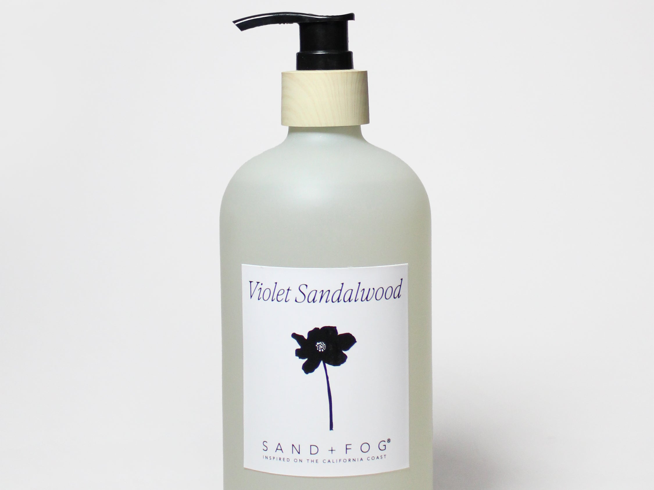 Liquid hand soap bottle with violet sandalwood label and black pump