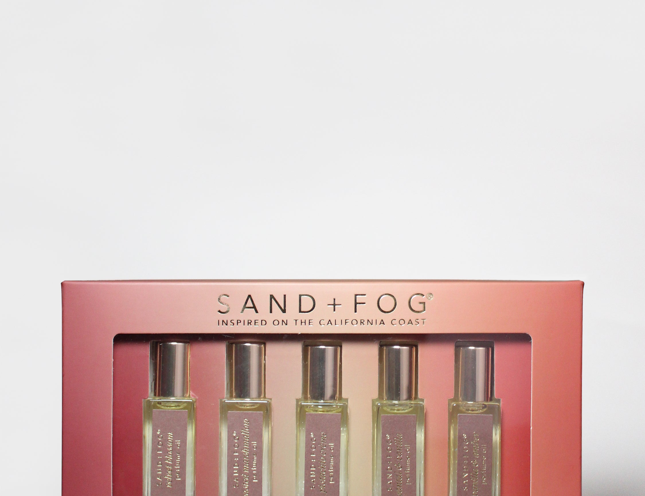 SANDFOG eau de parfum discovery set with multiple rollerball bottles in pink box