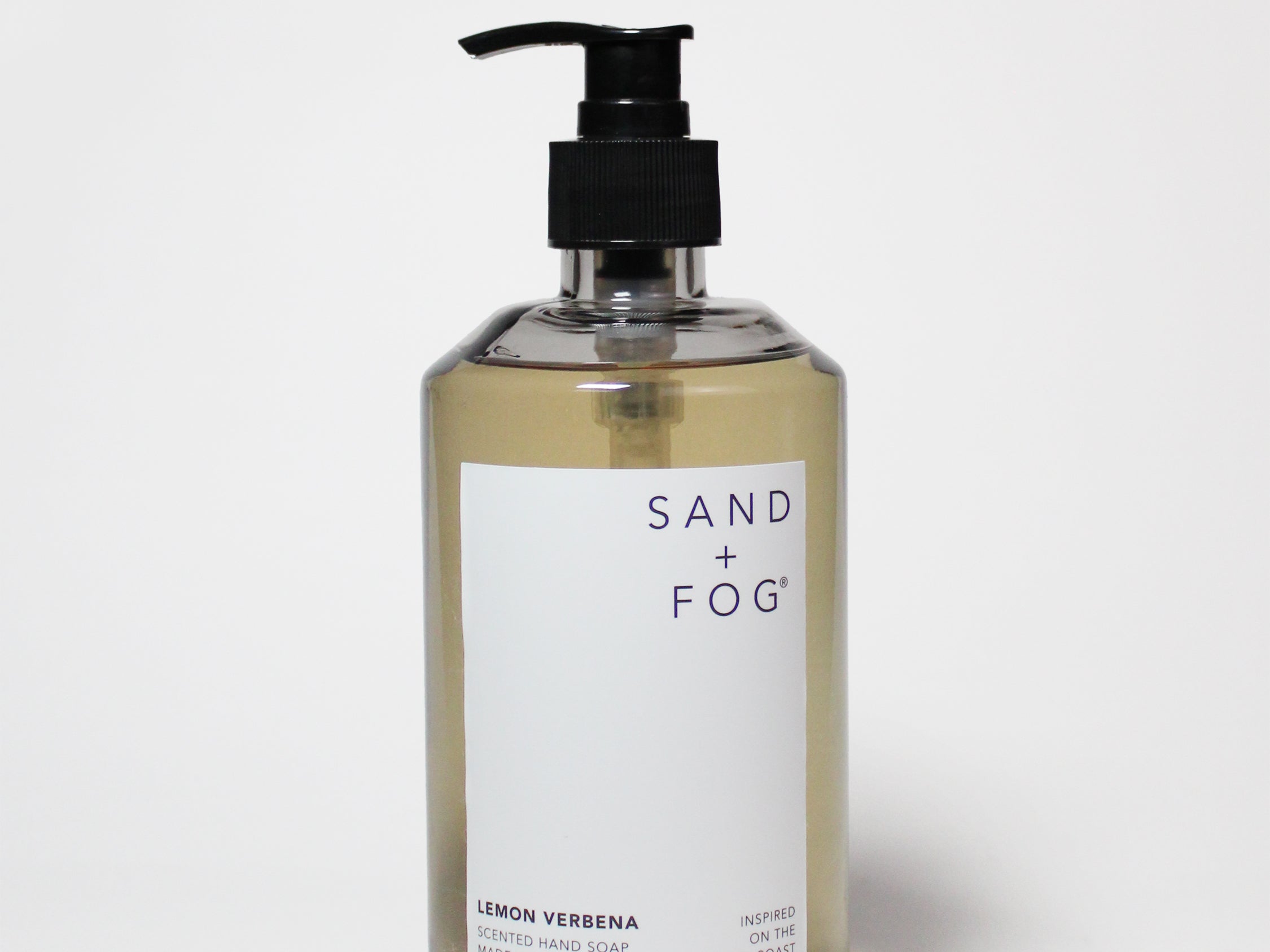 Liquid hand soap bottle with amber glass, black pump, lemon verbena label