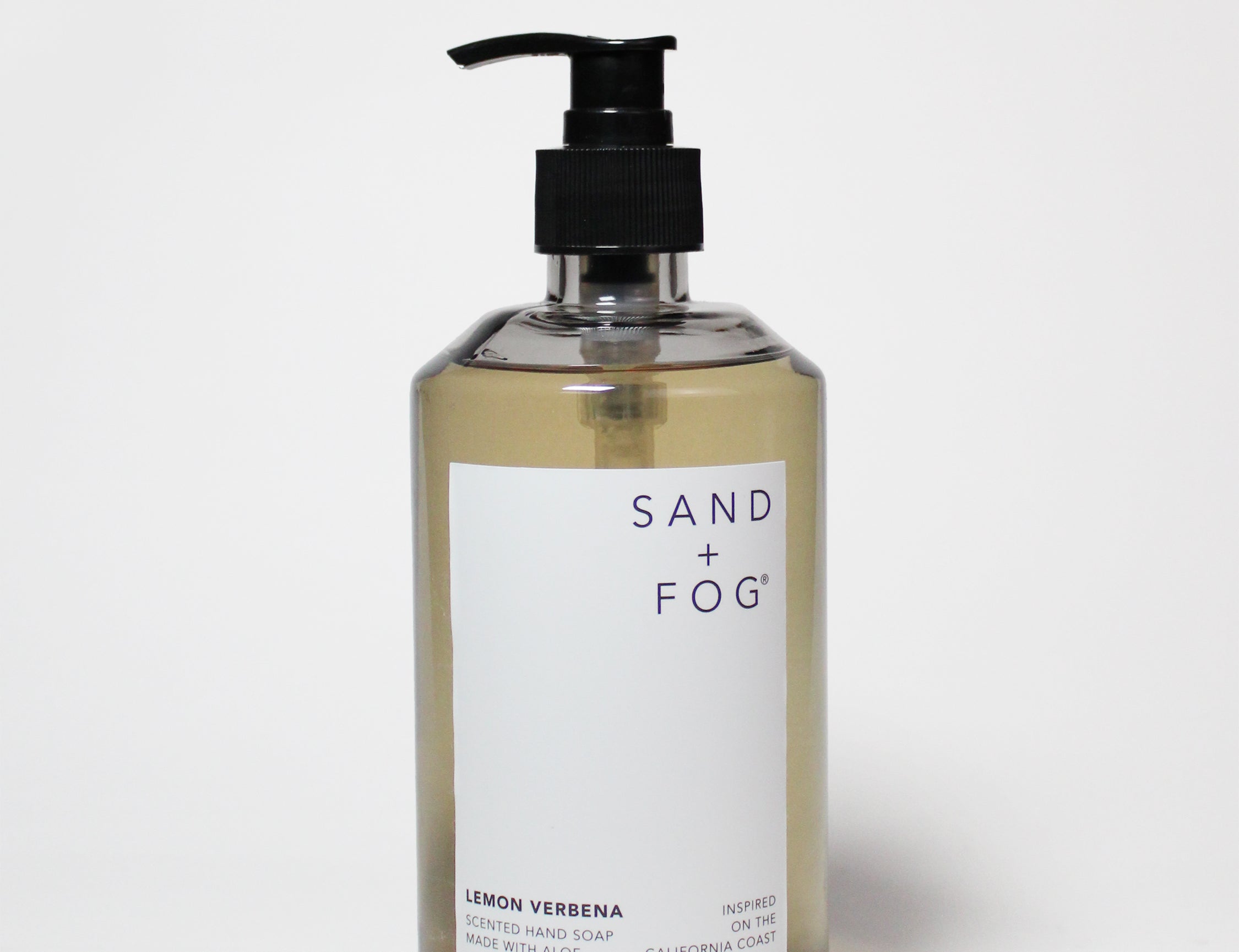 Liquid hand soap bottle with amber glass, black pump, lemon verbena label