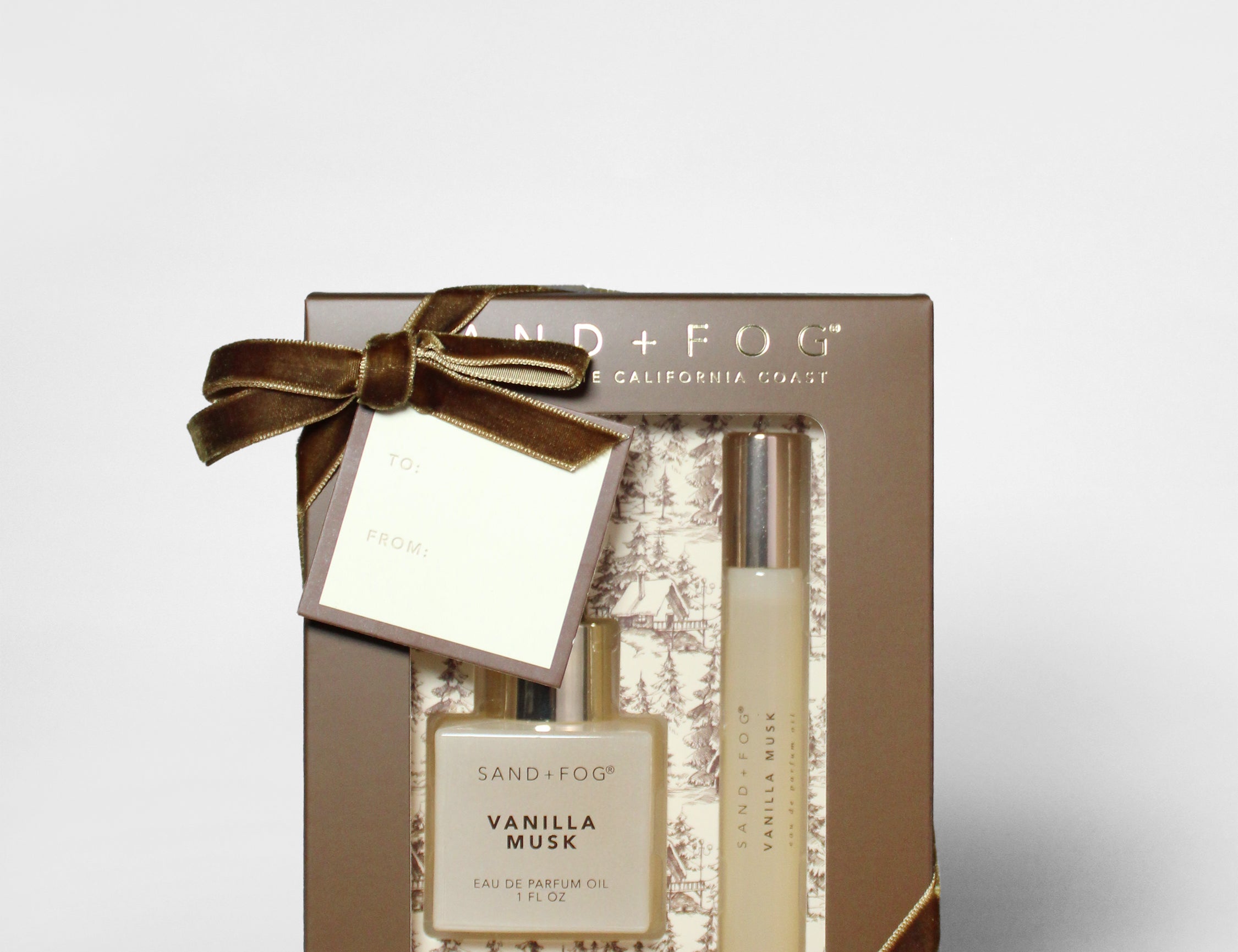Vanilla musk perfume oil rollerball set with dropper bottle, gift box, and ribbon bow
