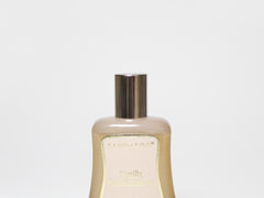 Vanilla marshmallow perfume oil roller bottle with gold cap, cream liquid
