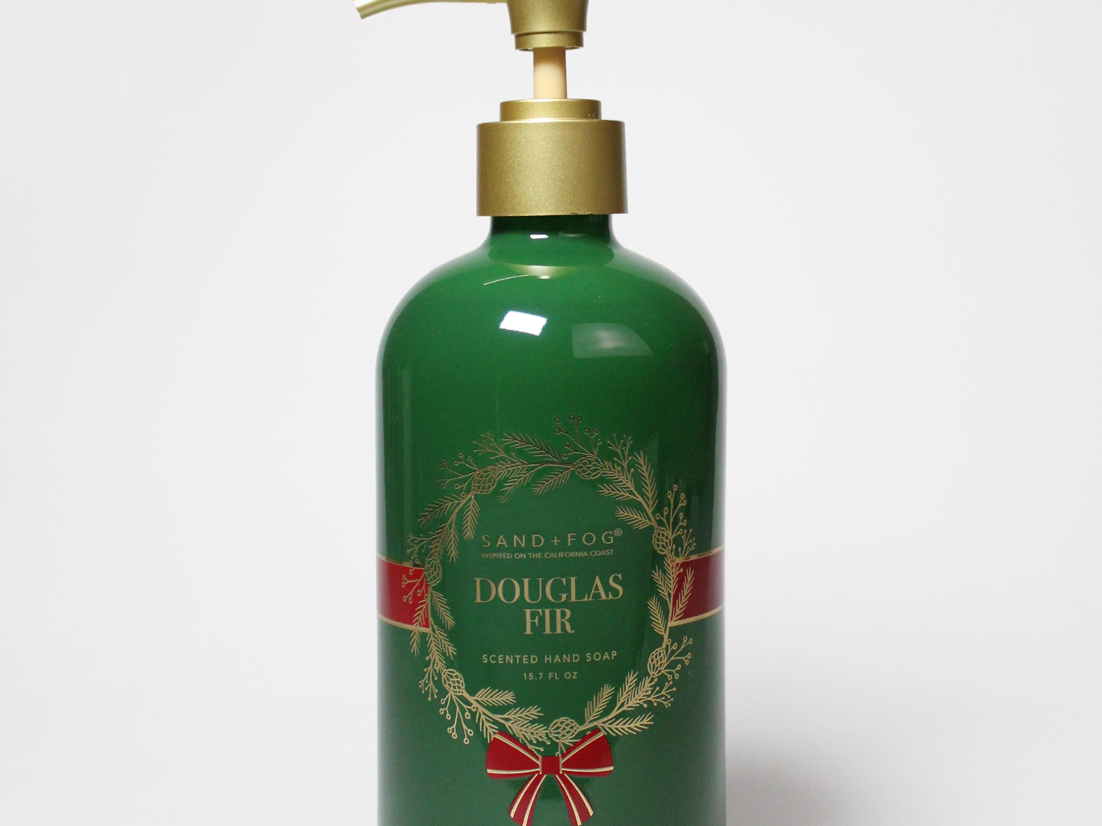 Douglas Fir liquid hand soap in a dark green bottle with a gold pump and decorative label