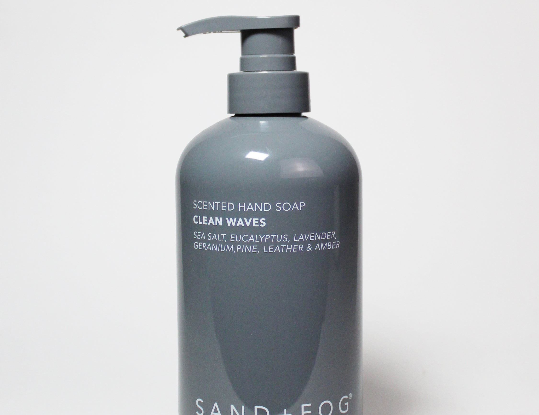 Dark gray scented liquid hand soap bottle with pump dispenser and printed label