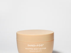 Whipped body butter jar, SAND+FOG Mango Gelato, cream-colored plastic tub with lid