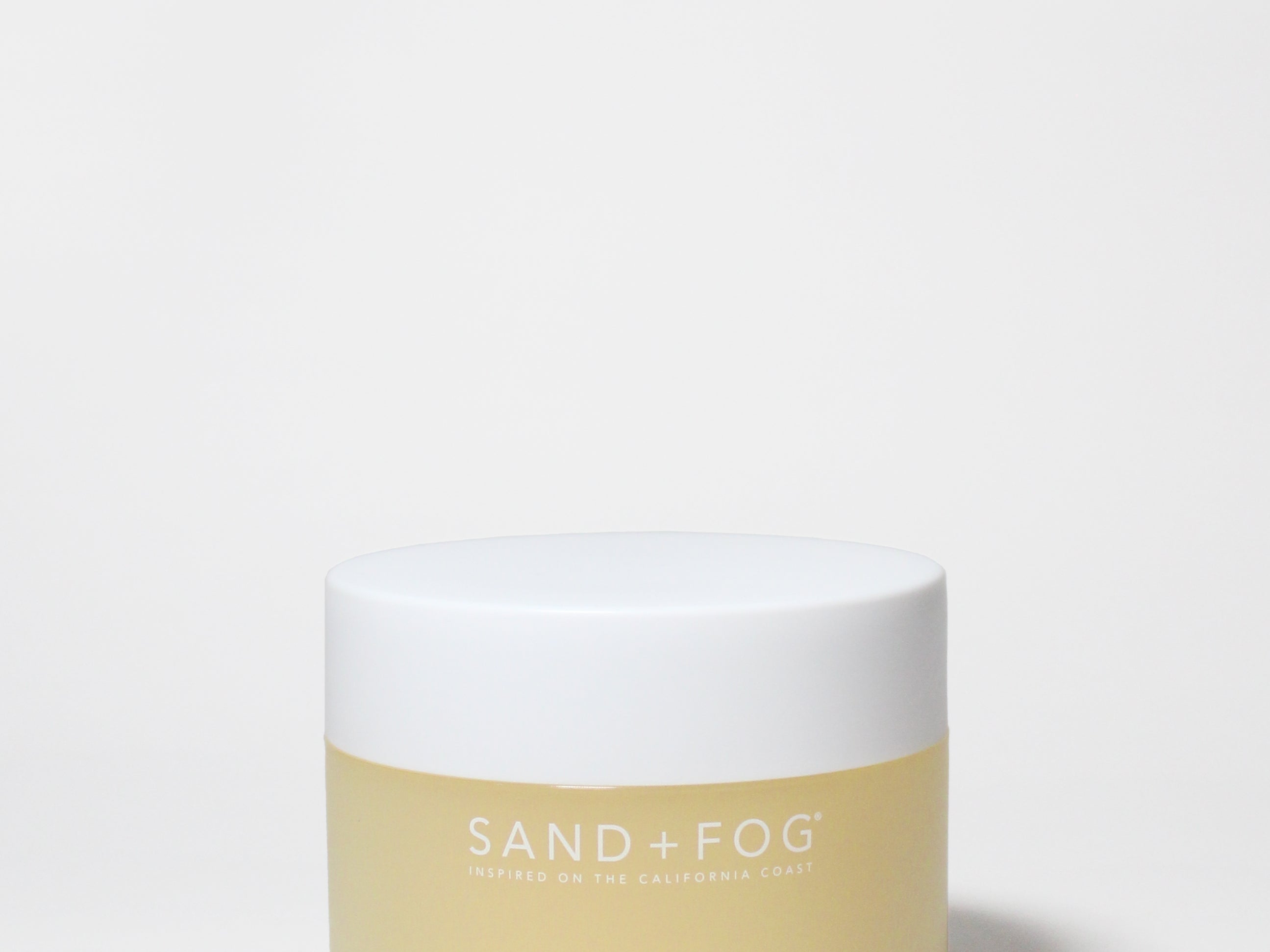 SanD + fog body scrub jar with white lid and gold label; pineapple coconut scent, 12 oz
