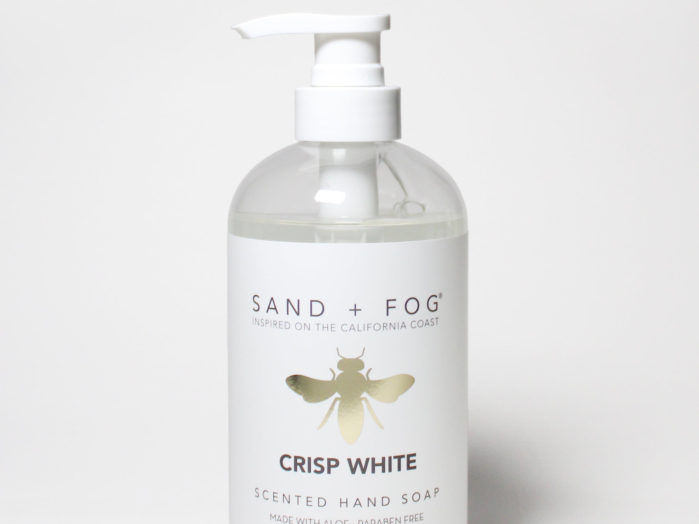 Liquid hand soap bottle with white pump; label reads Crisp White scented hand soap