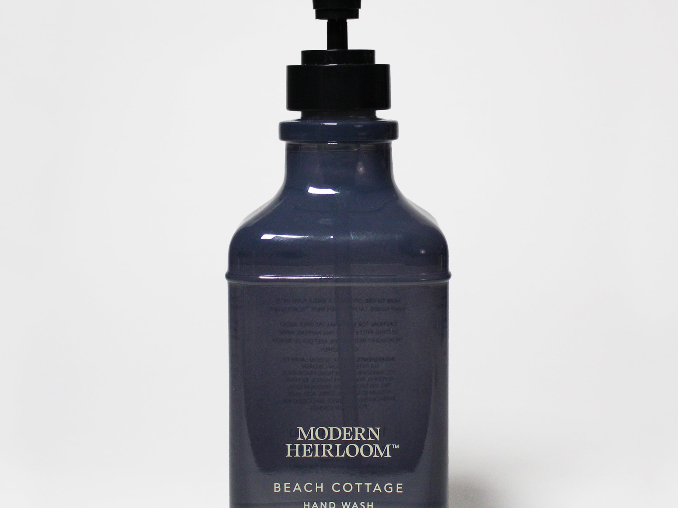 Dark blue liquid hand soap bottle with black pump dispenser
