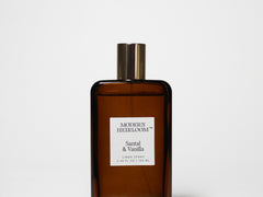 Amber glass linen spray bottle with gold cap and label