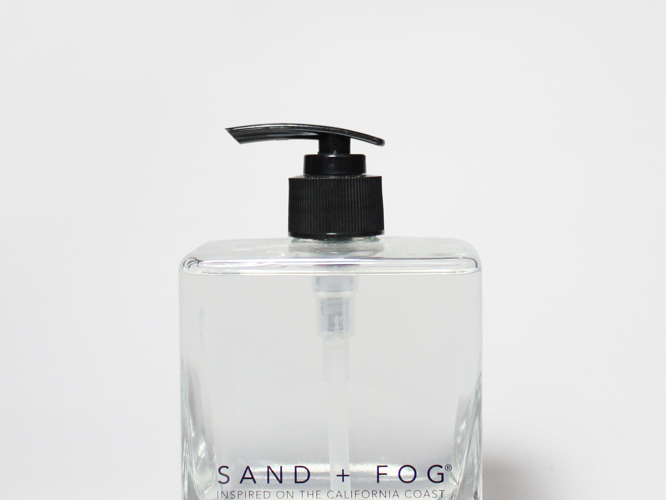 Teakwood liquid hand soap in a clear square bottle with a black pump