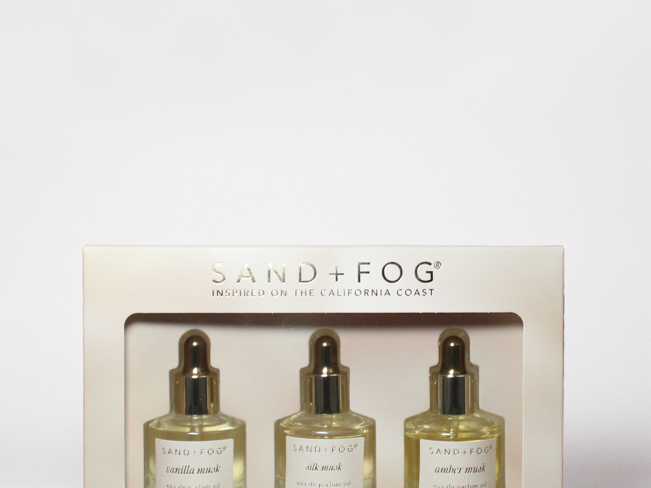 Perfume oil dropper set box with three glass bottles and gold droppers