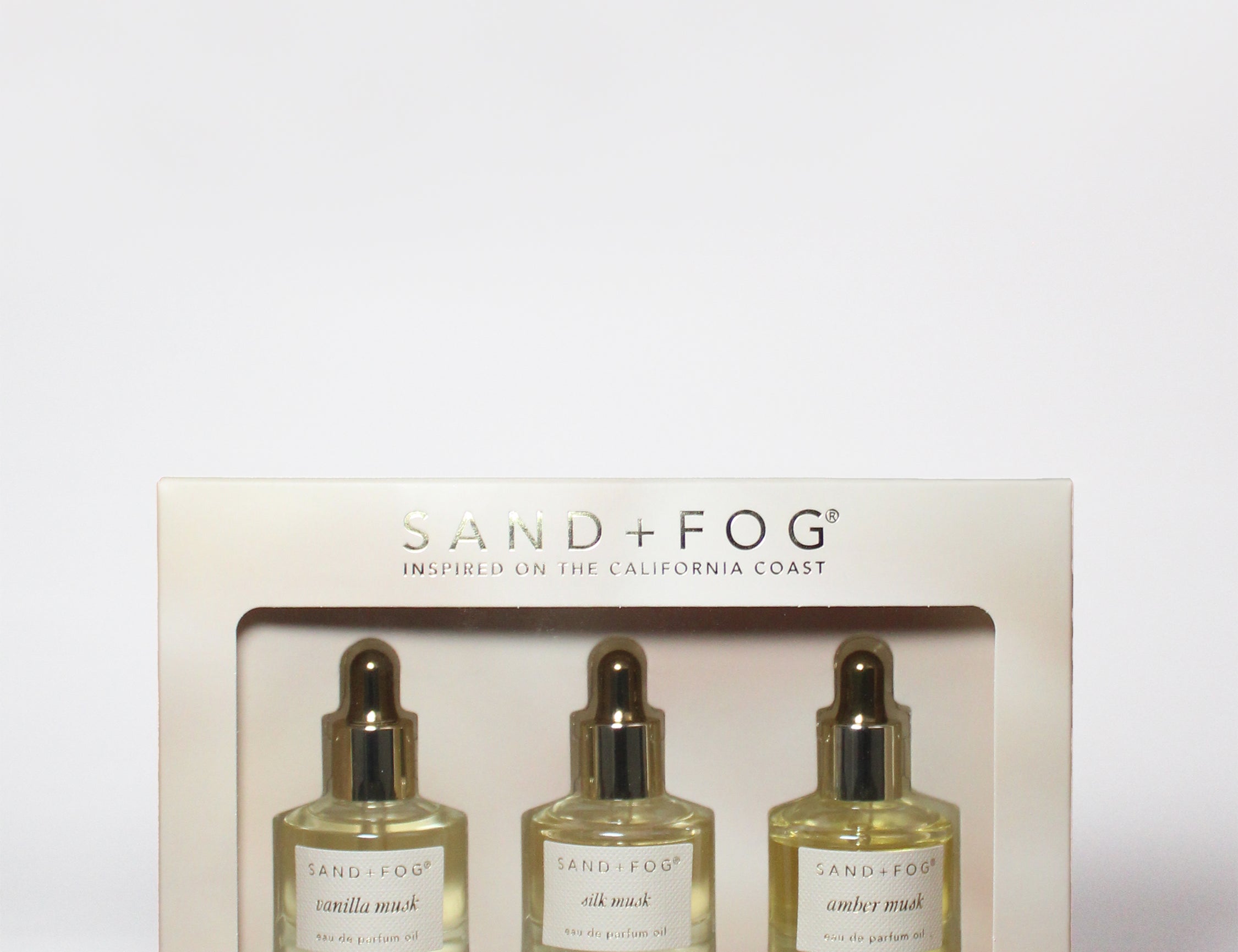 Perfume oil dropper set box with three glass bottles and gold droppers