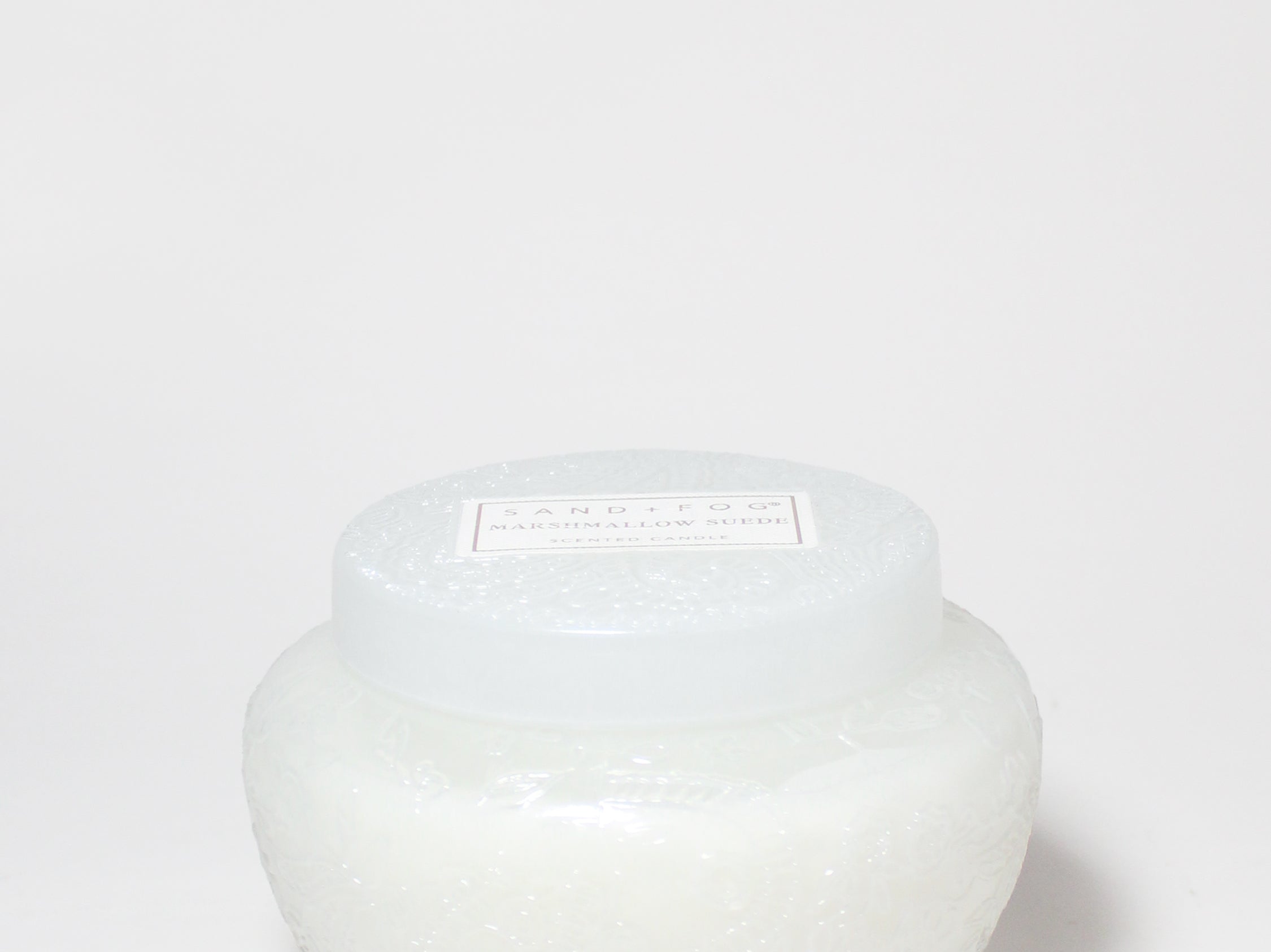 Marshmallow Suede scented candle in a rounded white glass jar with a fitted lid.