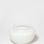 Marshmallow Suede 17 oz scented candle in a rounded white glass jar with two wicks.