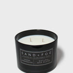 Black jar scented candle with two wicks and Sand+Fog label