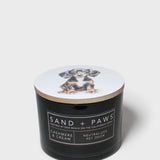 Black jar scented candle with Sand + Paws label; cashmere cream neutralized odor