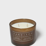 Caramel macchiato scented candle in brown glass jar, cream wax and two wicks