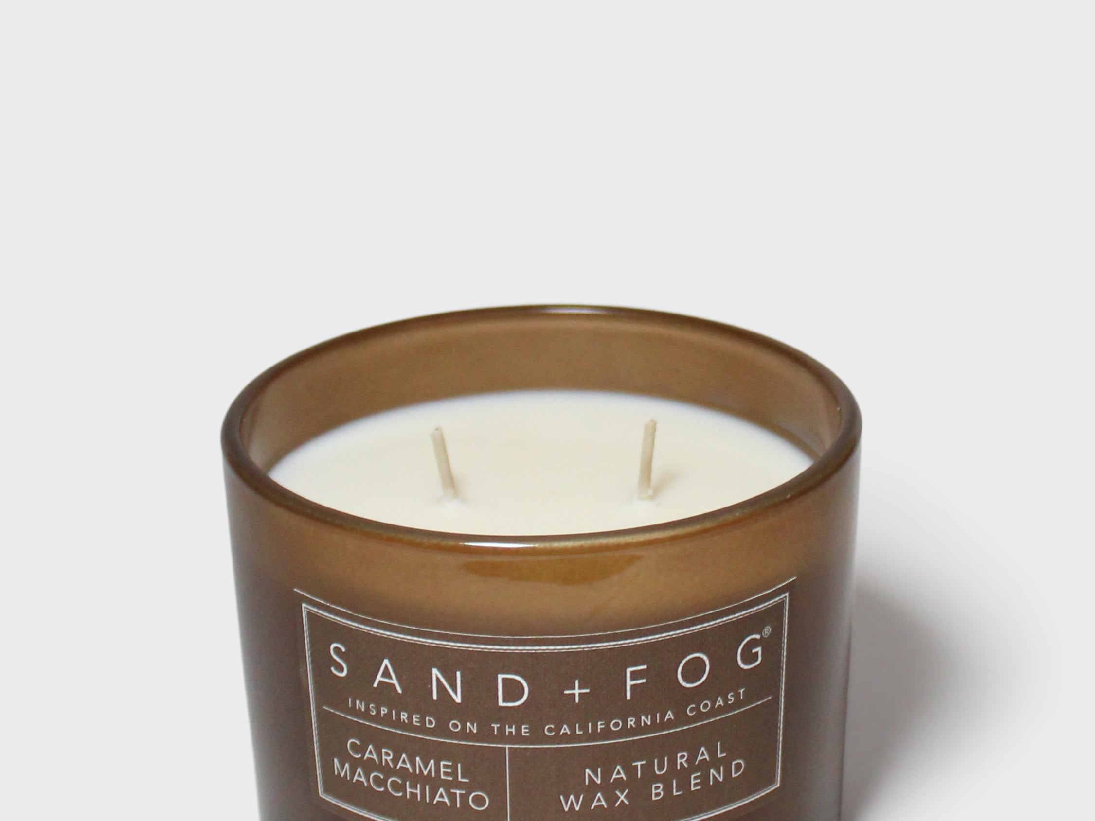 Caramel macchiato scented candle in brown glass jar, cream wax and two wicks