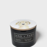 Orange vanilla scented candle in dark jar; dog portrait lid, neutral pet odor