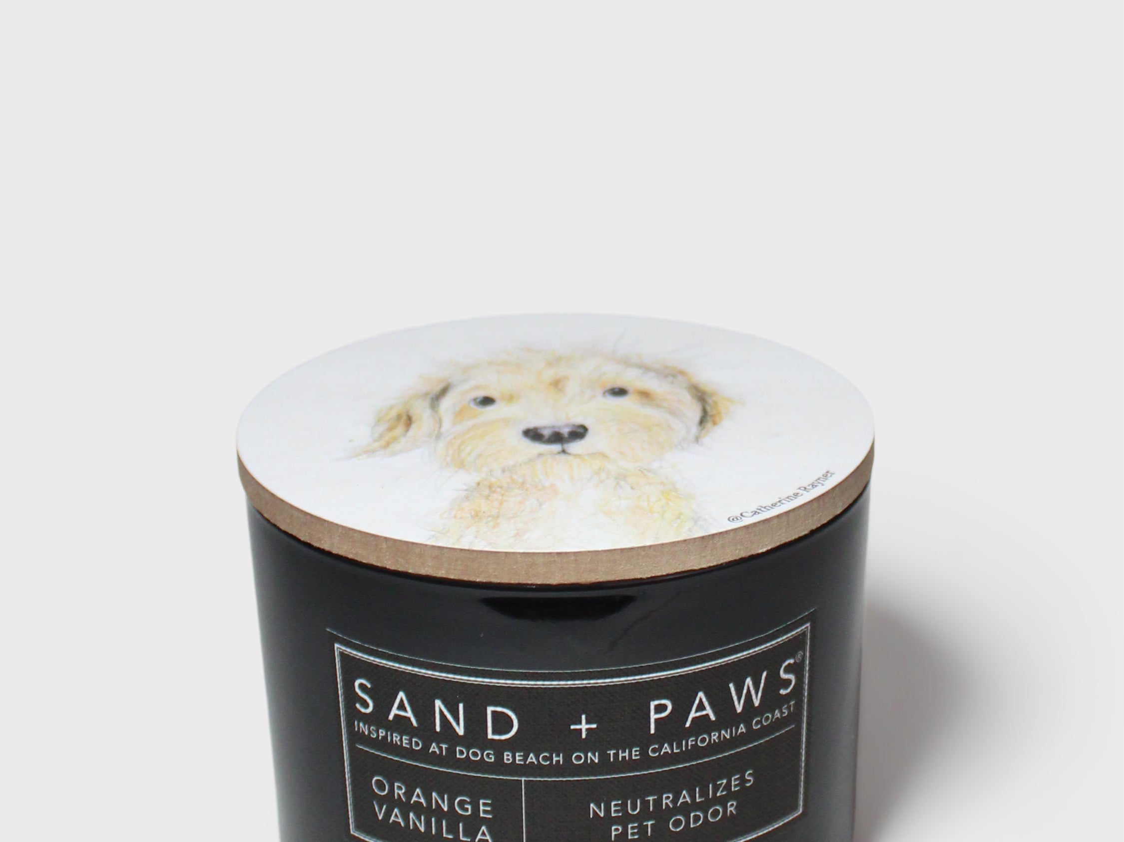 Orange vanilla scented candle in dark jar; dog portrait lid, neutral pet odor