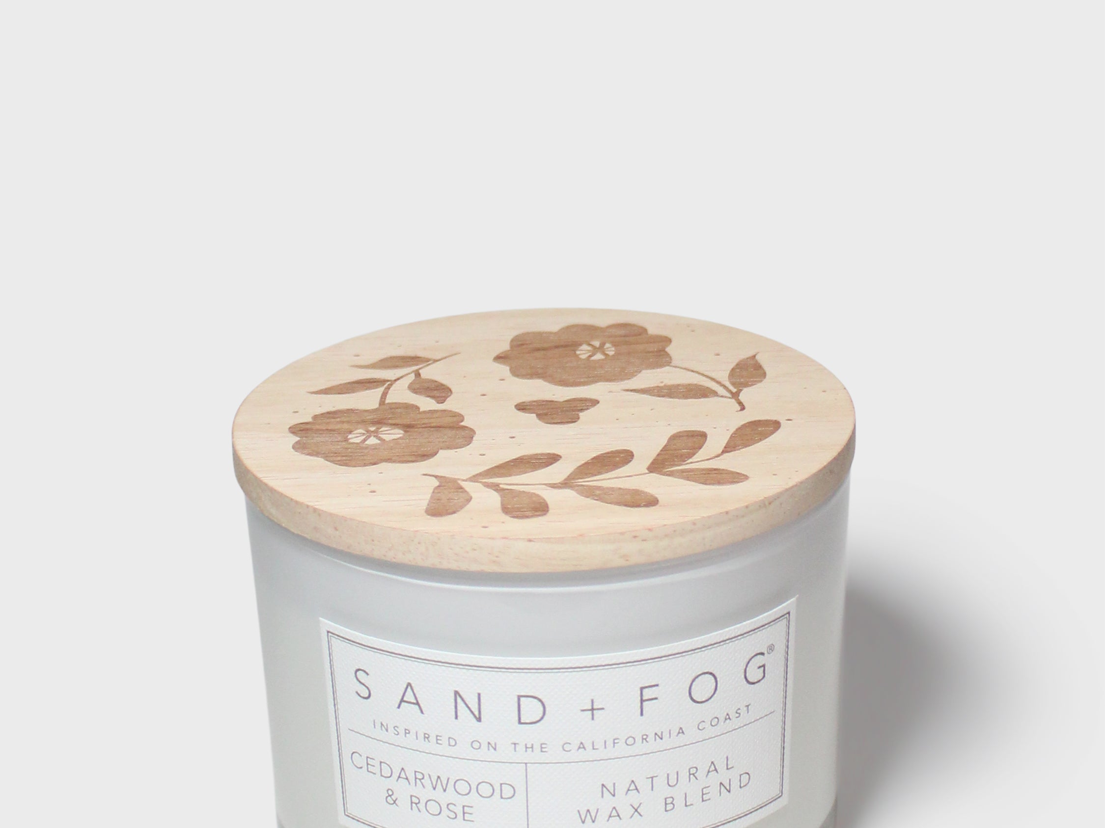 Cedarwood & Rose 12 oz scented candle in glass jar with floral lid