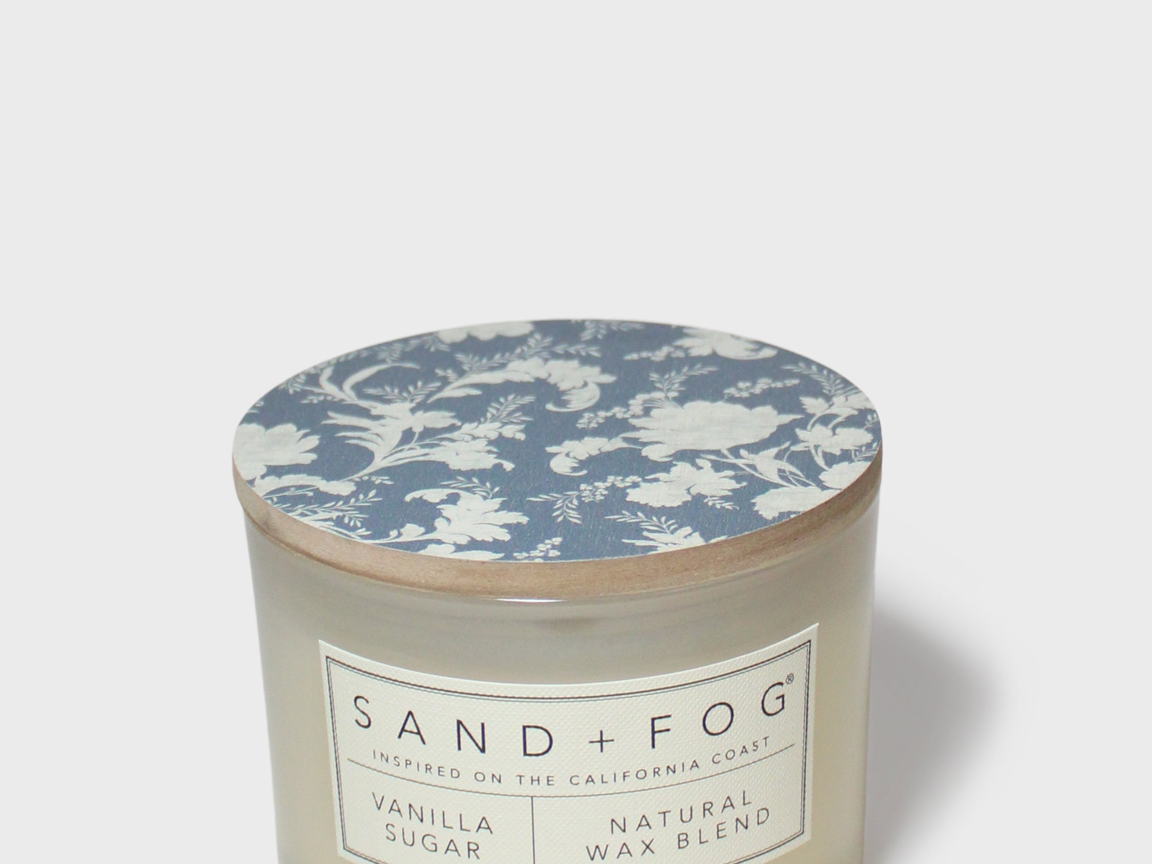 SAND + FOG scented candle, vanilla sugar, cream jar, blue floral lid.