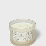 Vanilla-sugar scented candle in clear glass jar with two wicks and label