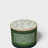 SAND + FOG Italian Bergamot scented candle in green glass jar with white botanical lid label