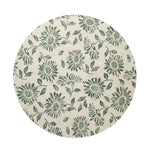 Scented candle lid with green floral print on a cream circular top