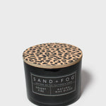 SAND+FOG scented candle in black jar with leopard-pattern lid