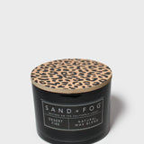 SAND+FOG scented candle in black jar with leopard-pattern lid