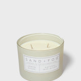 Glass jar scented candle with off-white wax, two wicks, 'Lemon Sugar' label