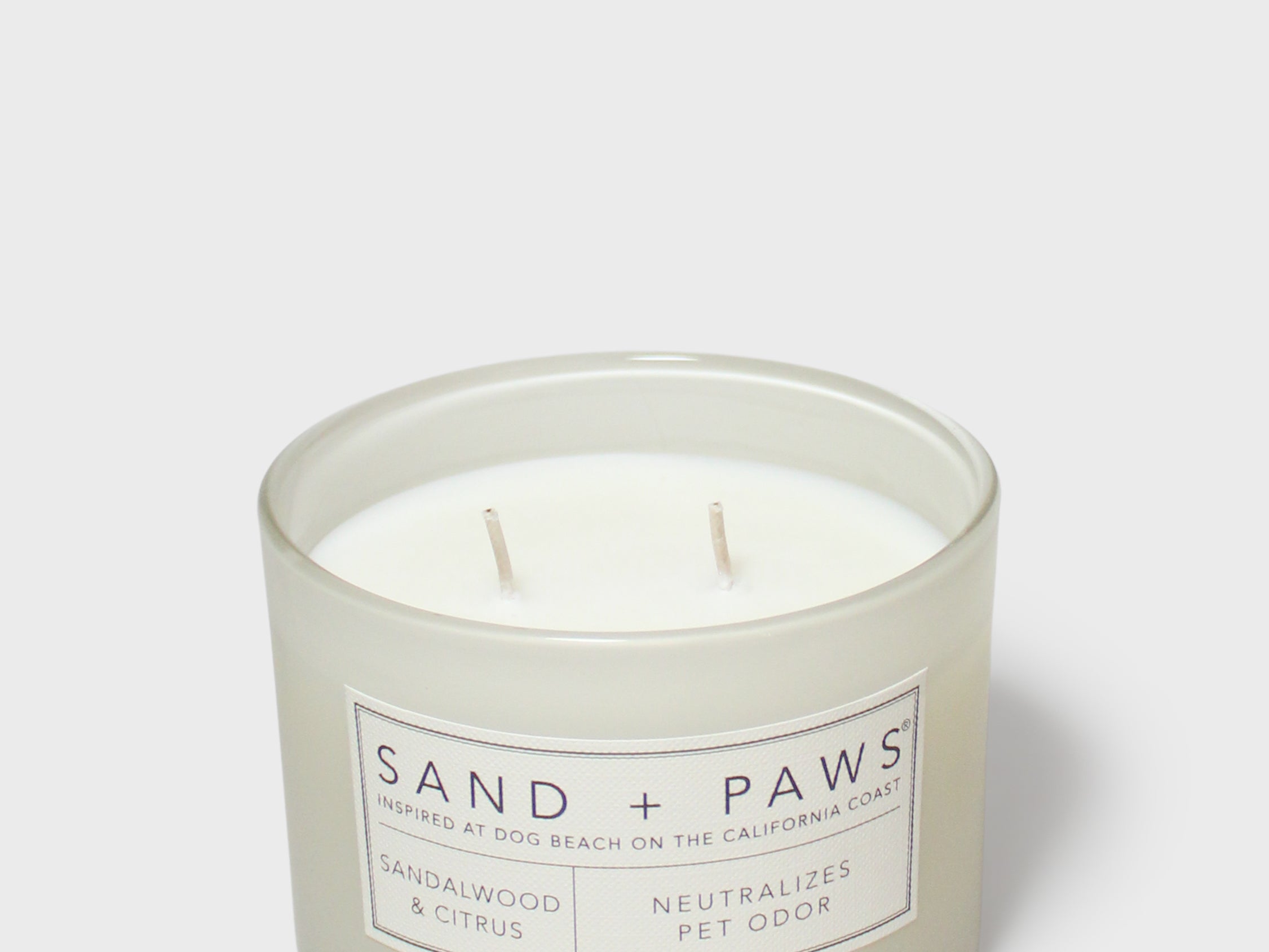 Sand + Paws 12 oz scented candle in frosted jar with two wicks