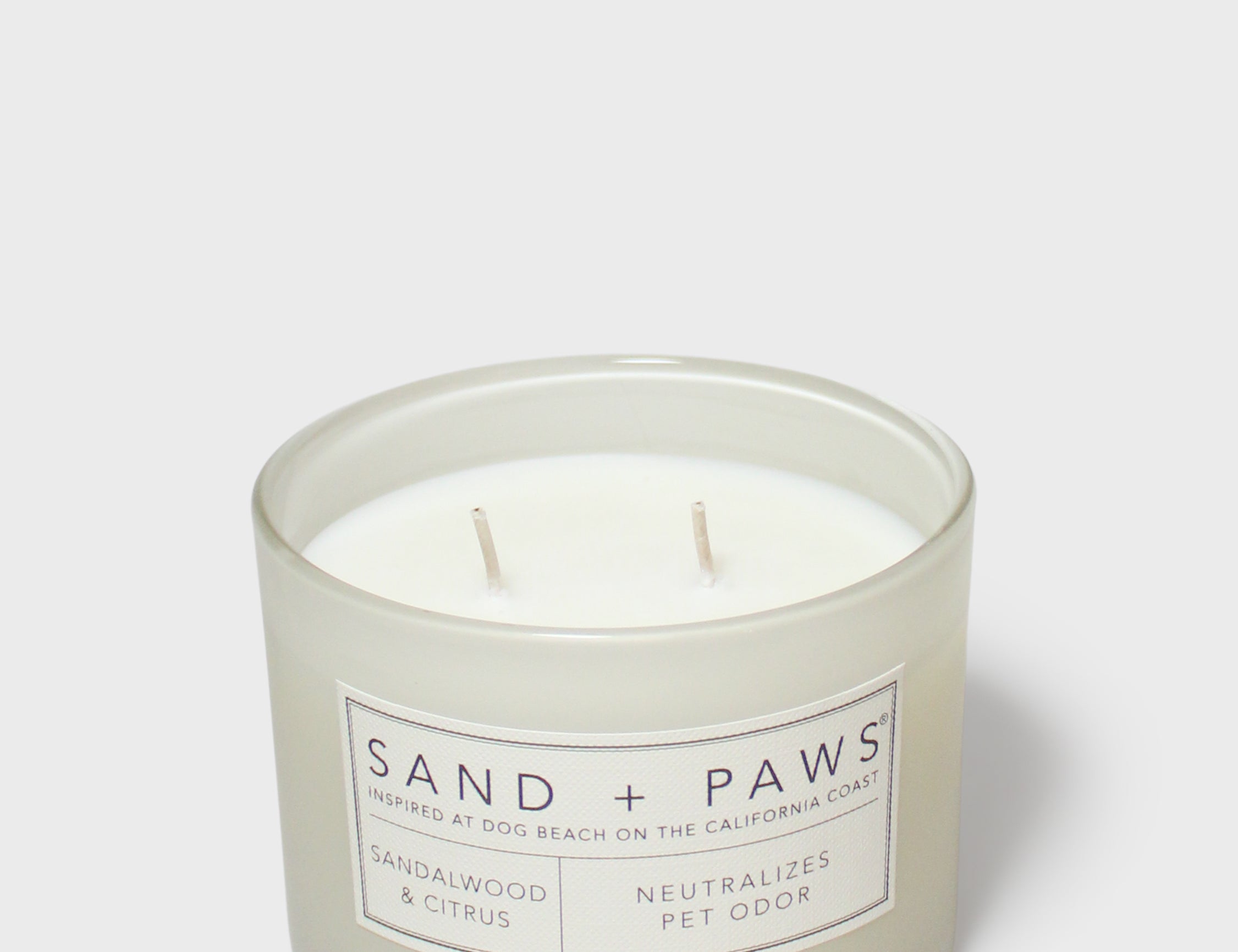 Sand + Paws 12 oz scented candle in frosted jar with two wicks