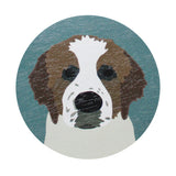 Dog-face graphic on top of scented candle lid in teal and tan