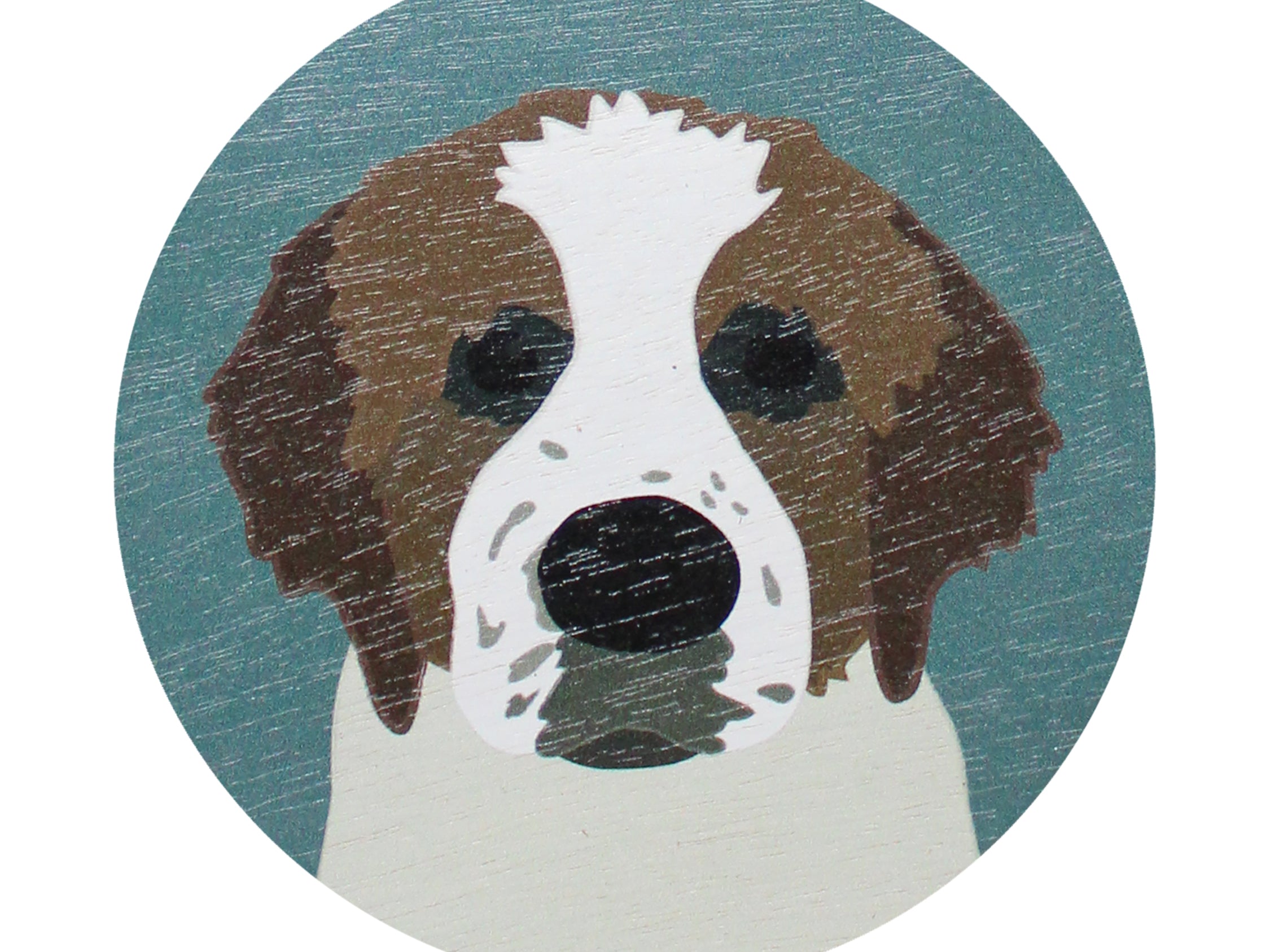 Dog-face graphic on top of scented candle lid in teal and tan