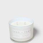 12 oz scented candle in white glass jar with two wicks and label