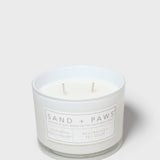 12 oz scented candle in white glass jar with two wicks and label