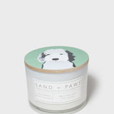 Scented candle jar with dog-face lid and printed scent label
