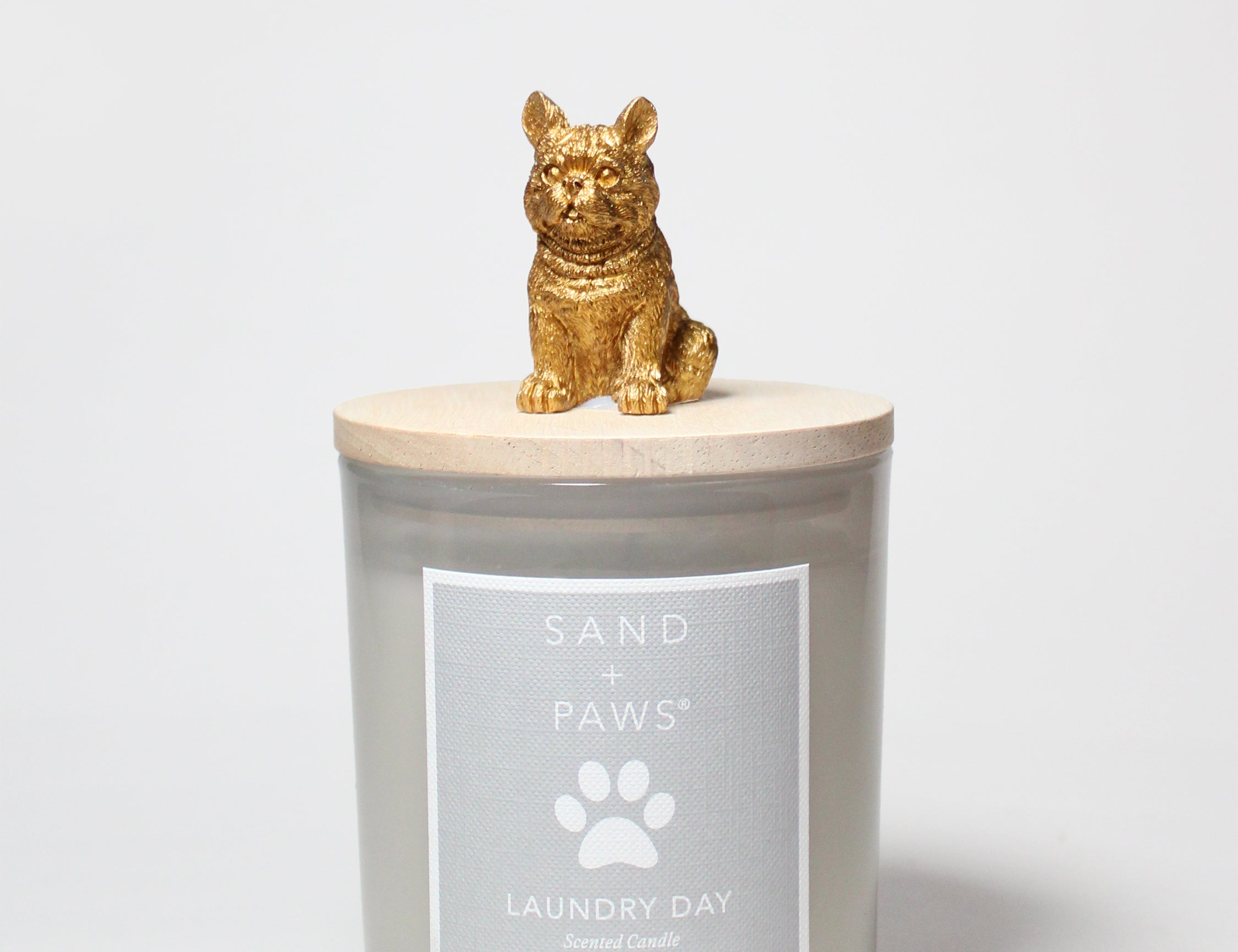 10 oz scented candle in frosted gray glass jar with gold cat figurine on lid